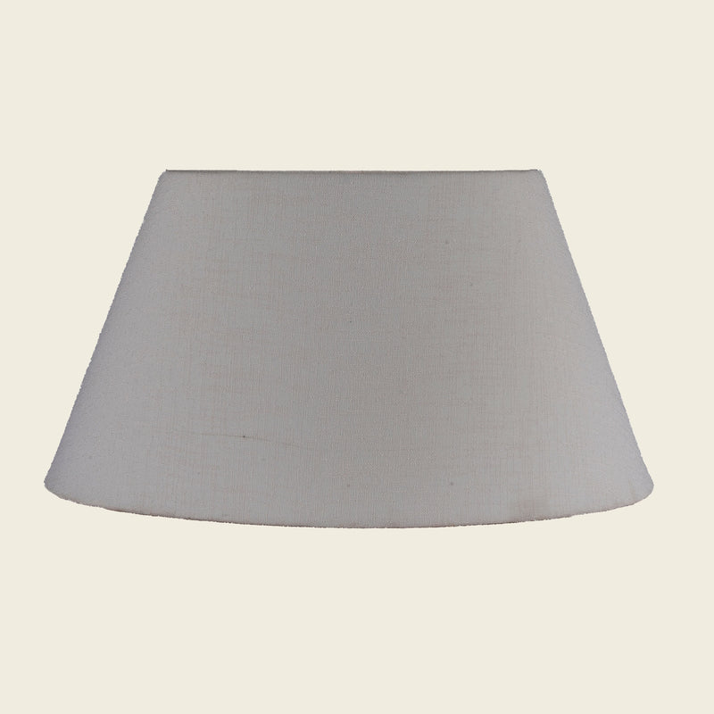 Empire shape lamp shade in light pink color.