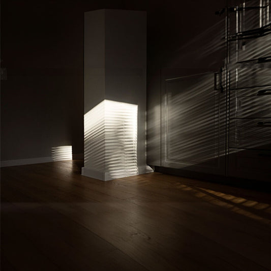 Abstract image of light rays entering an empty room