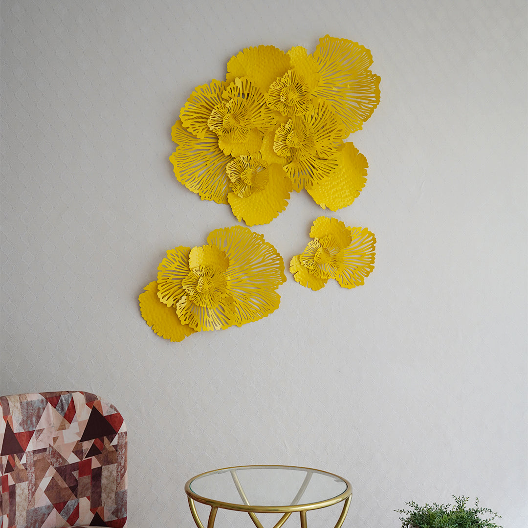 Yellow floral metallic wall art set of 3 in a living room set-up.