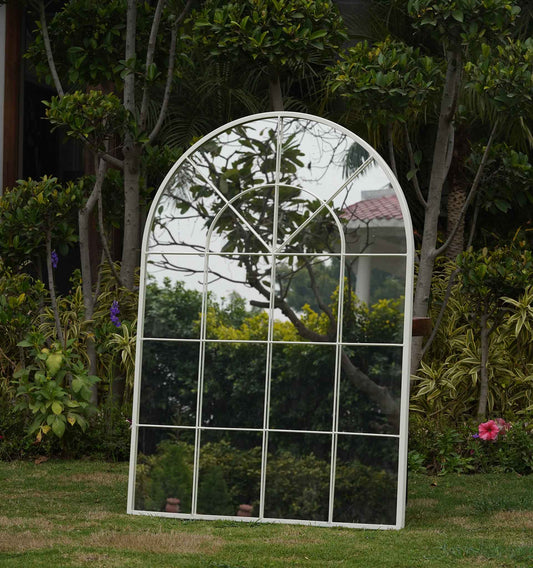 A large white metallic mirror shaped like a window