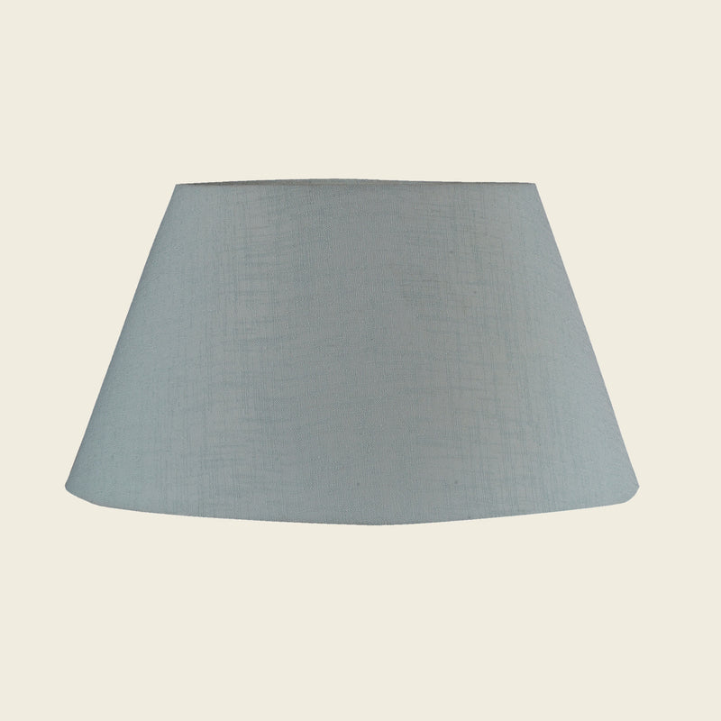 Empire shape lamp shade in light green color.