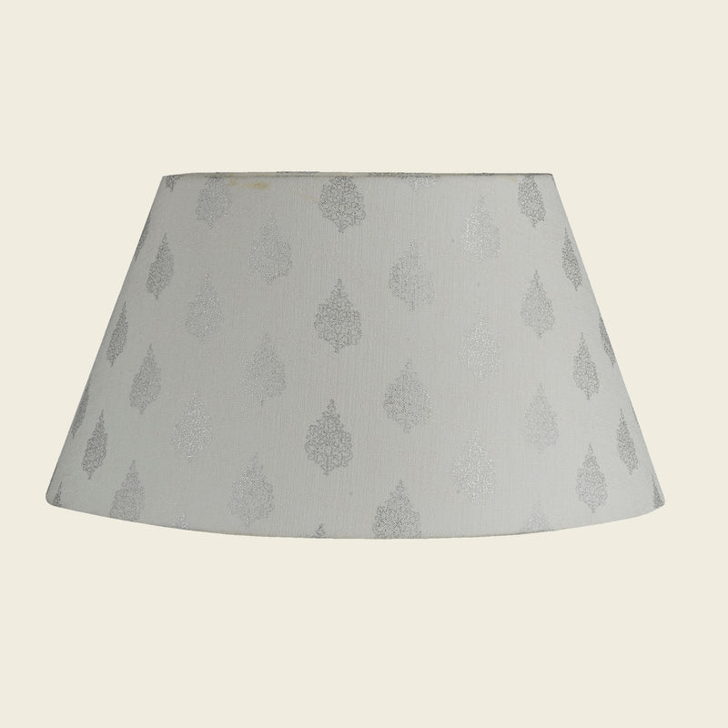 Empire shape lamp shade in white color.