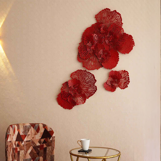 Red floral metallic wall art set of 3 in a living room set-up.