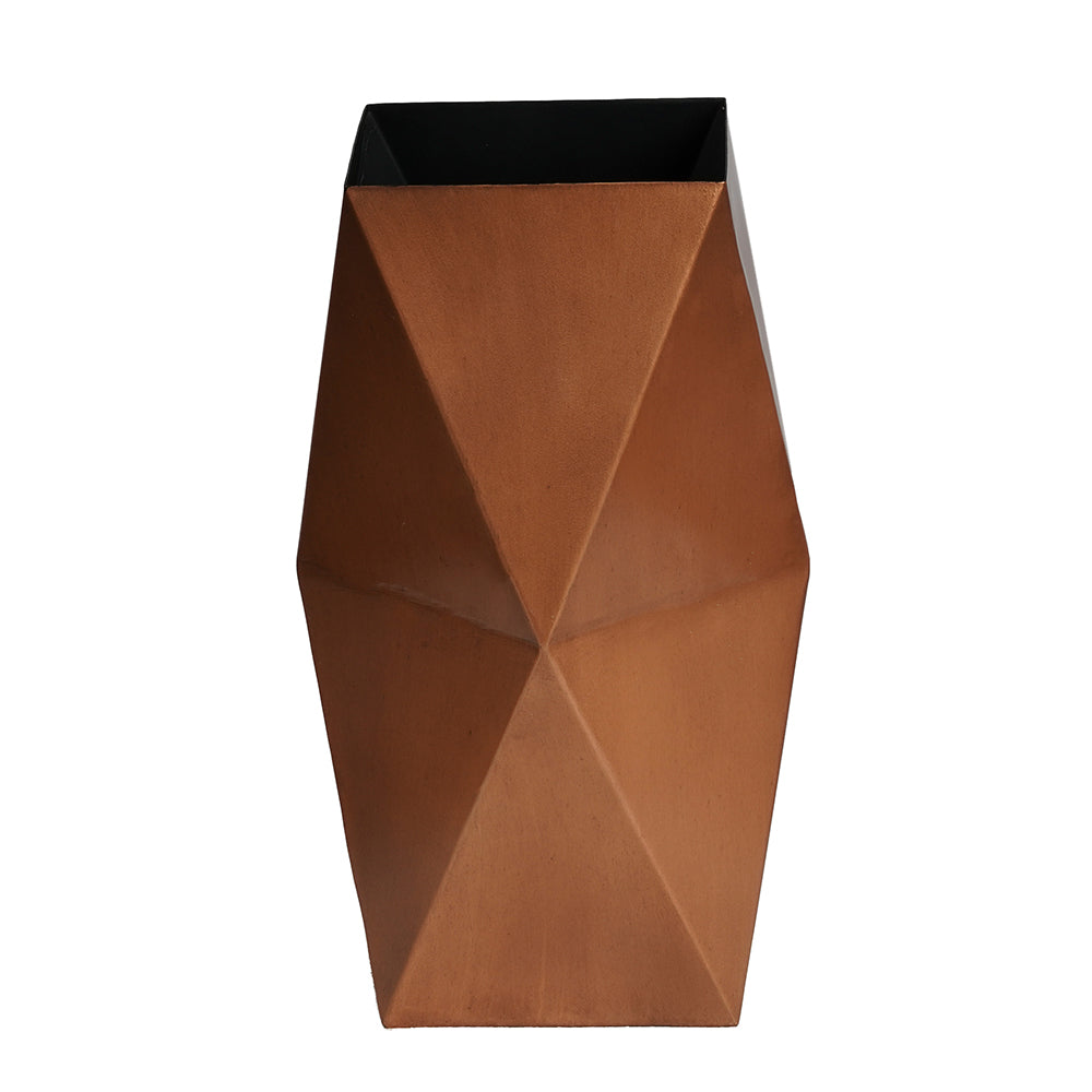 Top view of a large hexagonal metallic vase in copper finish on a plain background.