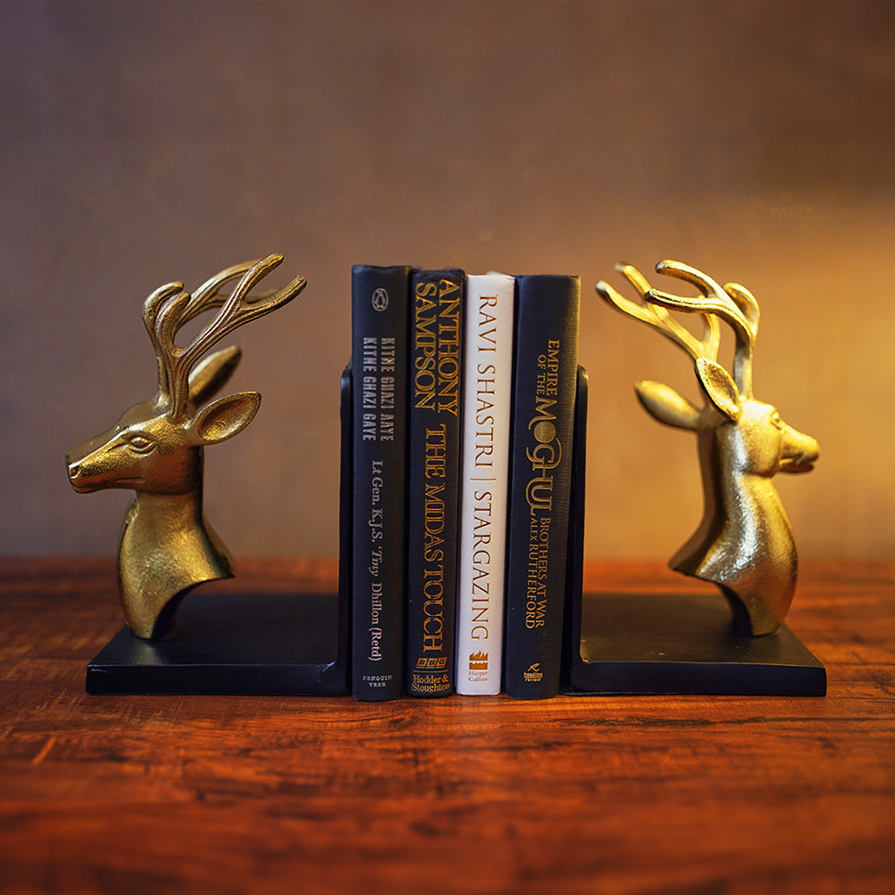 Bookends set of 2 in golden metallic deer head and antlers design with 4 books in between in a front view.