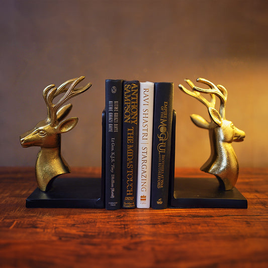 Bookends set of 2 in golden metallic deer head and antlers design with 4 books in between in a front view.