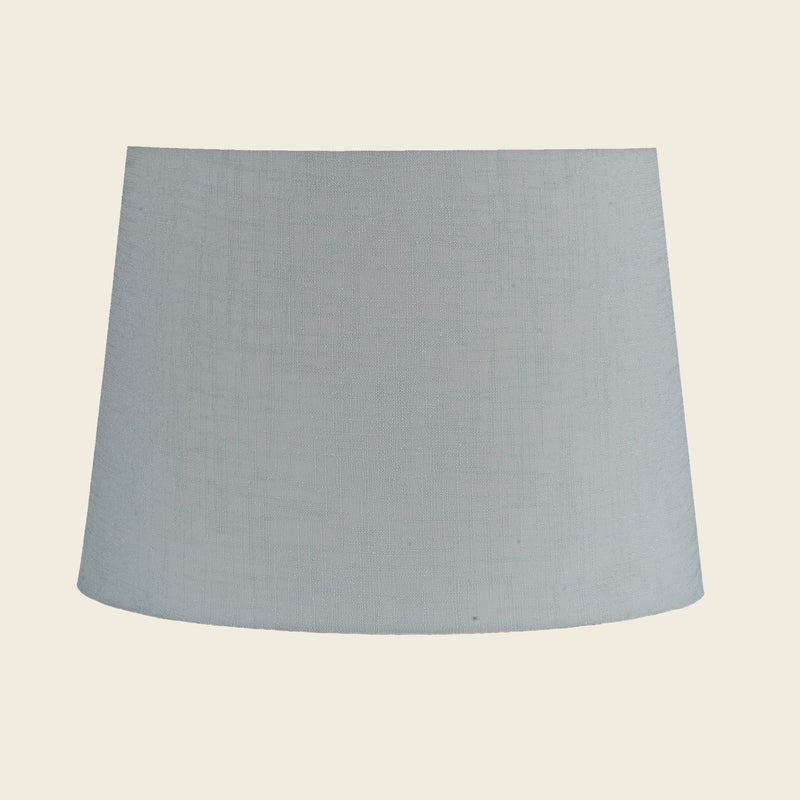 Tapered drum shape lamp shade in light green color.