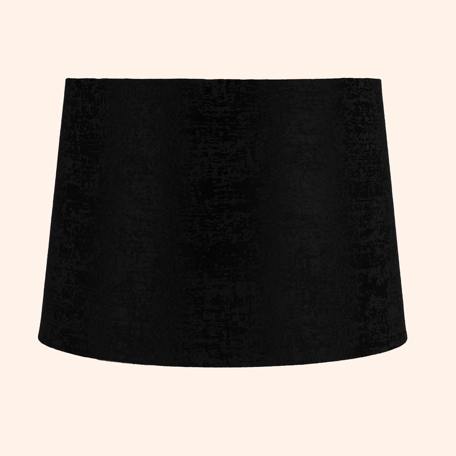 Tapered drum shape lamp shade in black color.