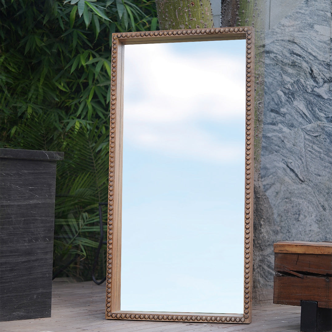 Large floor mirror in hand carved mango wood frame.