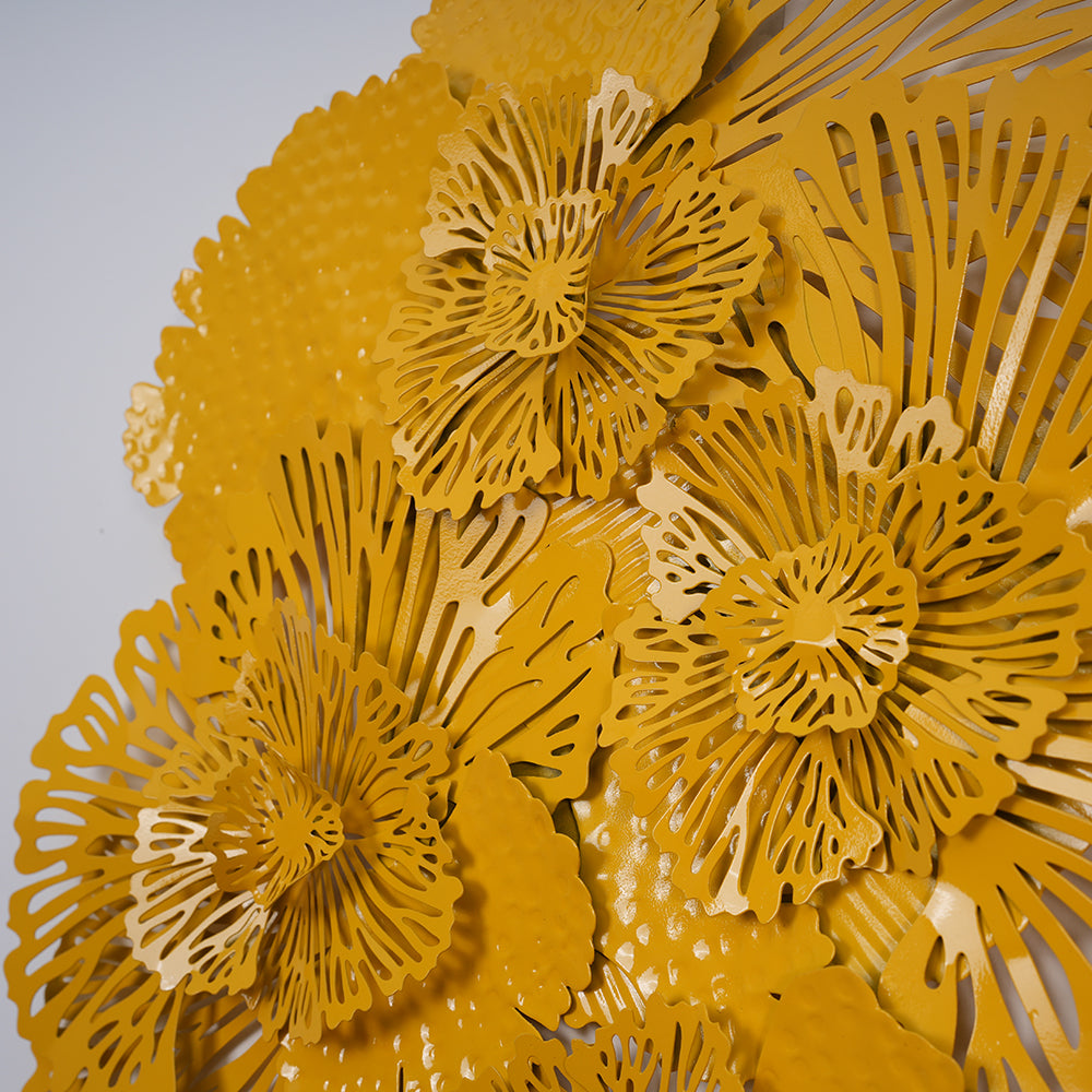 Close up view of a metallic wall art in yellow color.