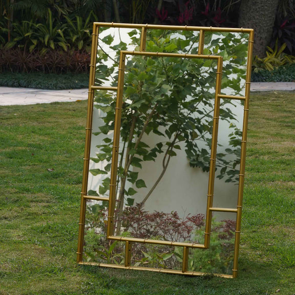 Front view of a large rectangular metallic mirror in a bamboo themed frame.