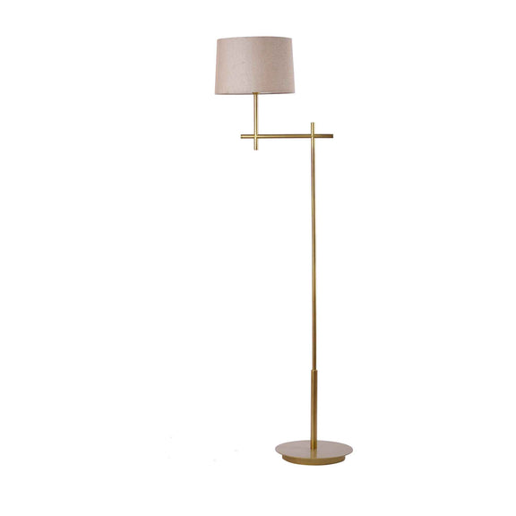 Tall, minimalistic design golden floor lamp with shade on a plain background