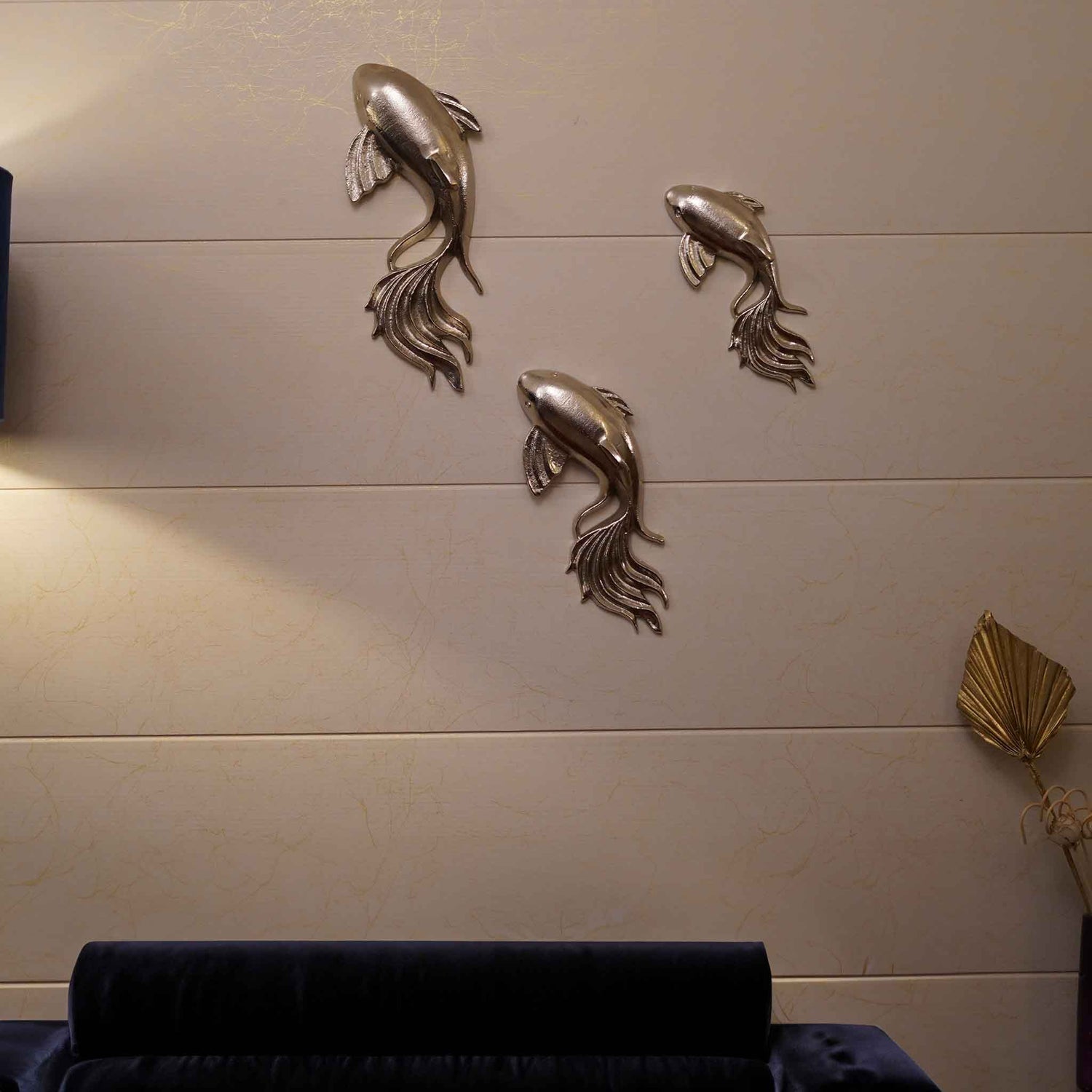 Set of 3 nickel chrome finish metallic wall art fish in a living room set-up