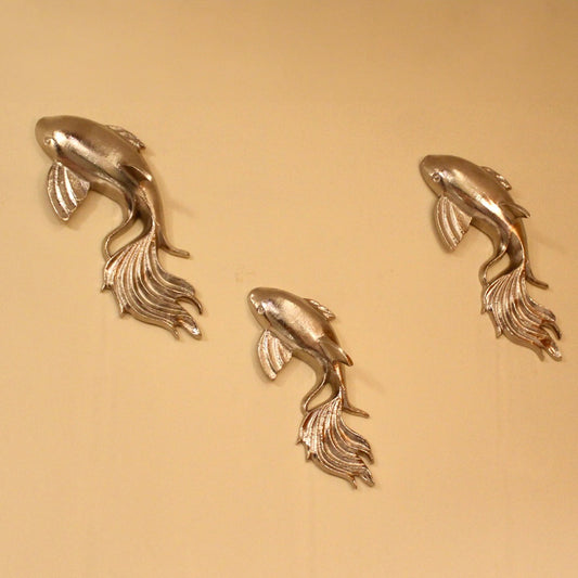 Set of 3 metallic fish design wall art.