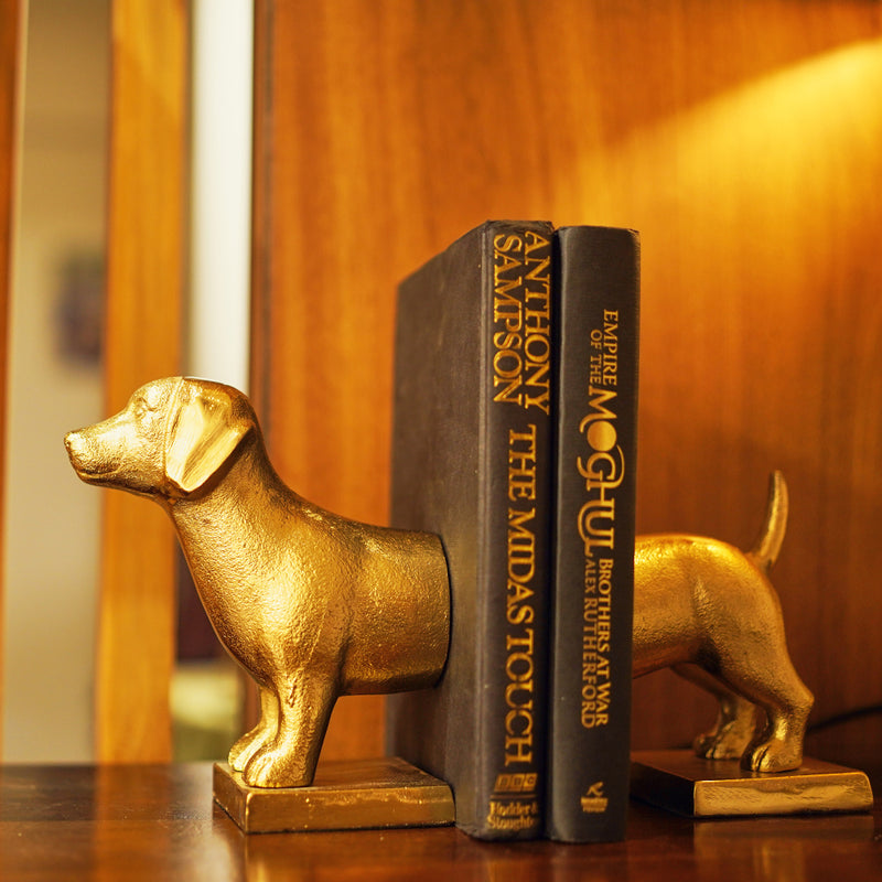 Side view of a metallic set of bookends which is in the design of a dog.