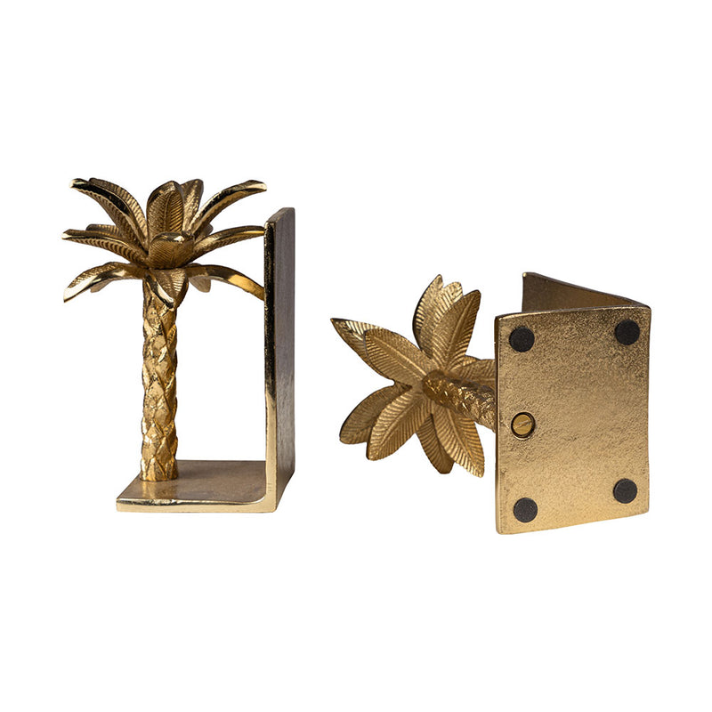 Golden metallic palm tree shaped bookends in a plain background top and base view.