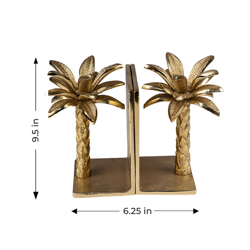 Golden metallic palm tree shaped bookends in a plain background with dimensions.