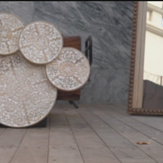 Video of a circular hand-carved mango wood wall art.