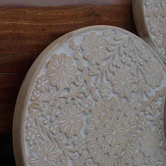 Close up image of hand-carving details on mango wood work in a wall panel.