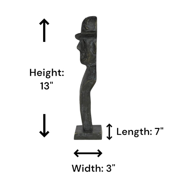 Side view of a black metallic table-top sculpture of a man wearing a tilted hat in a plain white background with dimensions shown.