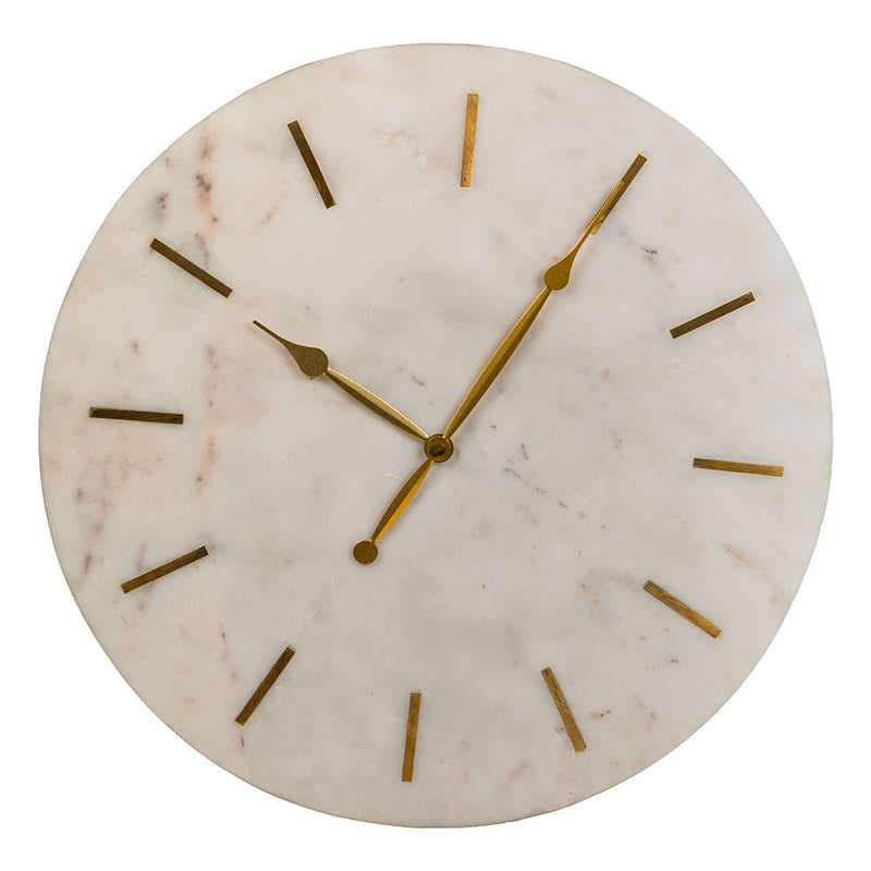 A large and heavy white marble clock with golden hands and hours marked with brass inlay in a plain white background.