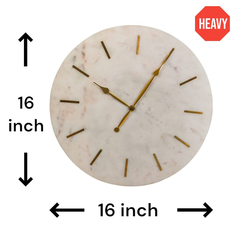 A large and heavy white marble clock with golden hands and hours marked with brass inlay in a plain white background with dimensions.