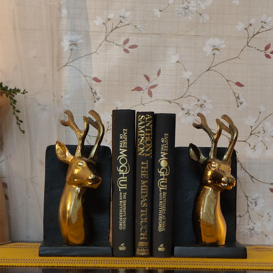 Bookends set of 2 in golden metallic deer head and antlers design with 4 books in between from front angle.