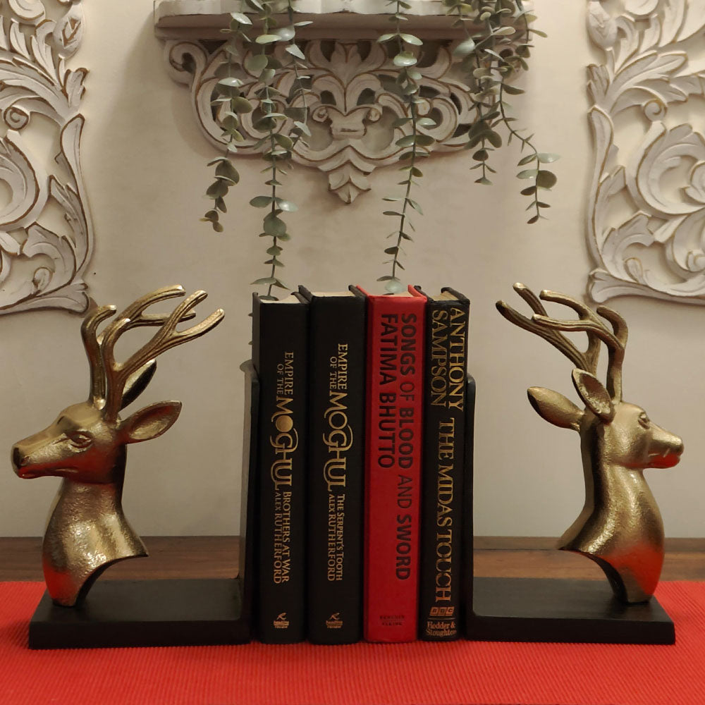 Bookends set of 2 in golden metallic deer head and antlers design with 4 books in between in a front view.